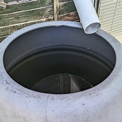 A rainwater collector tub sometimes called a water butt